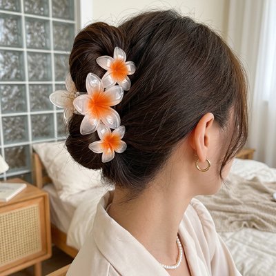Pince à cheveux fleur orange élégante
