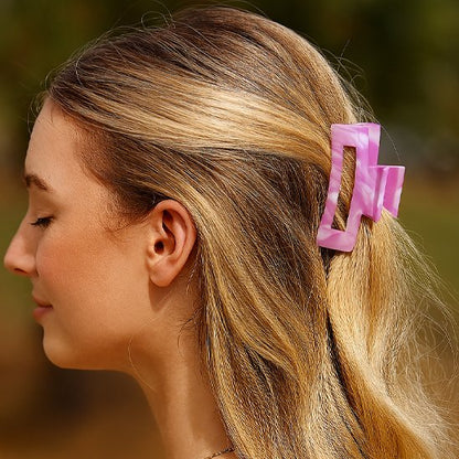 Pince a cheveux​ rose maintient bien les cheveux